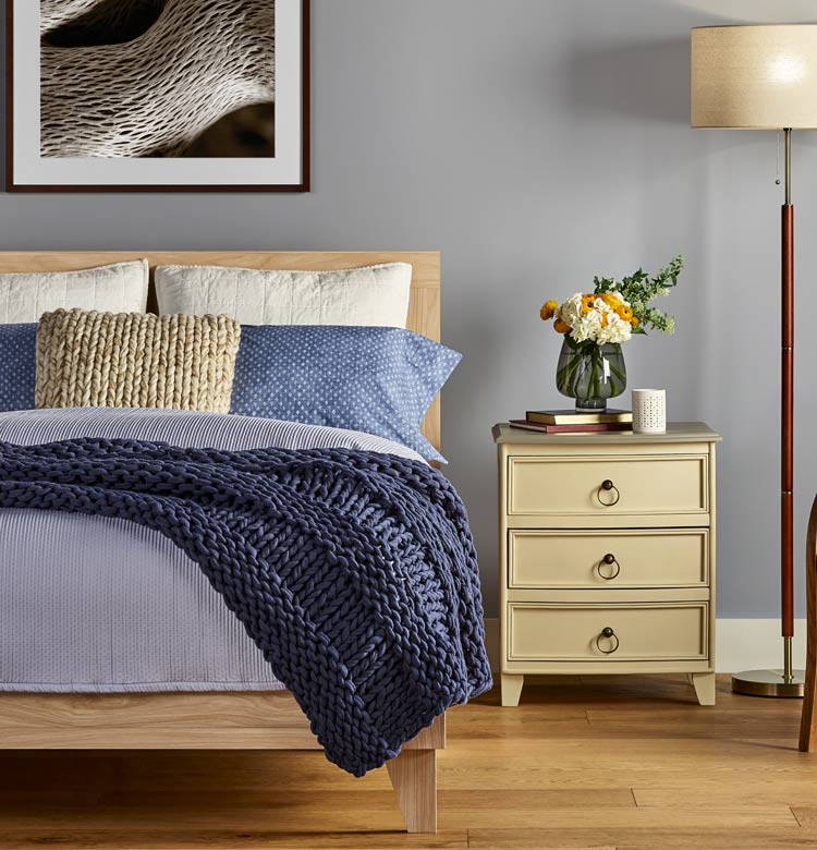 Bedroom with new oak hardwood flooring from Flooring America